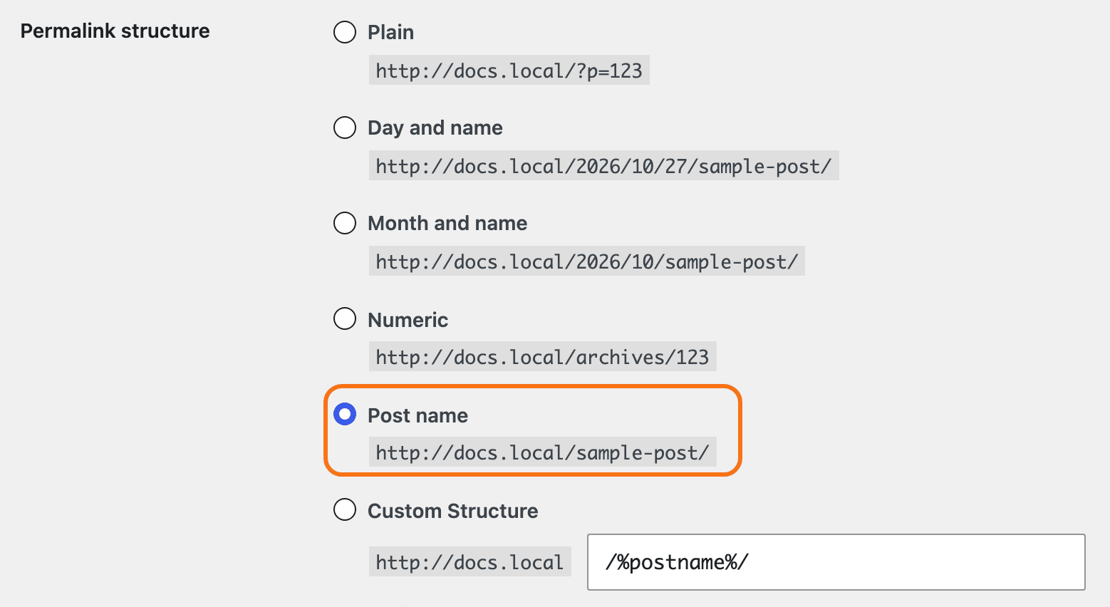 Settings > Permalinks, Permalink structure: Plain, Day and name, Month and name, Numeric, Post name and Custom Structure, with Post name selected and outlined in orange